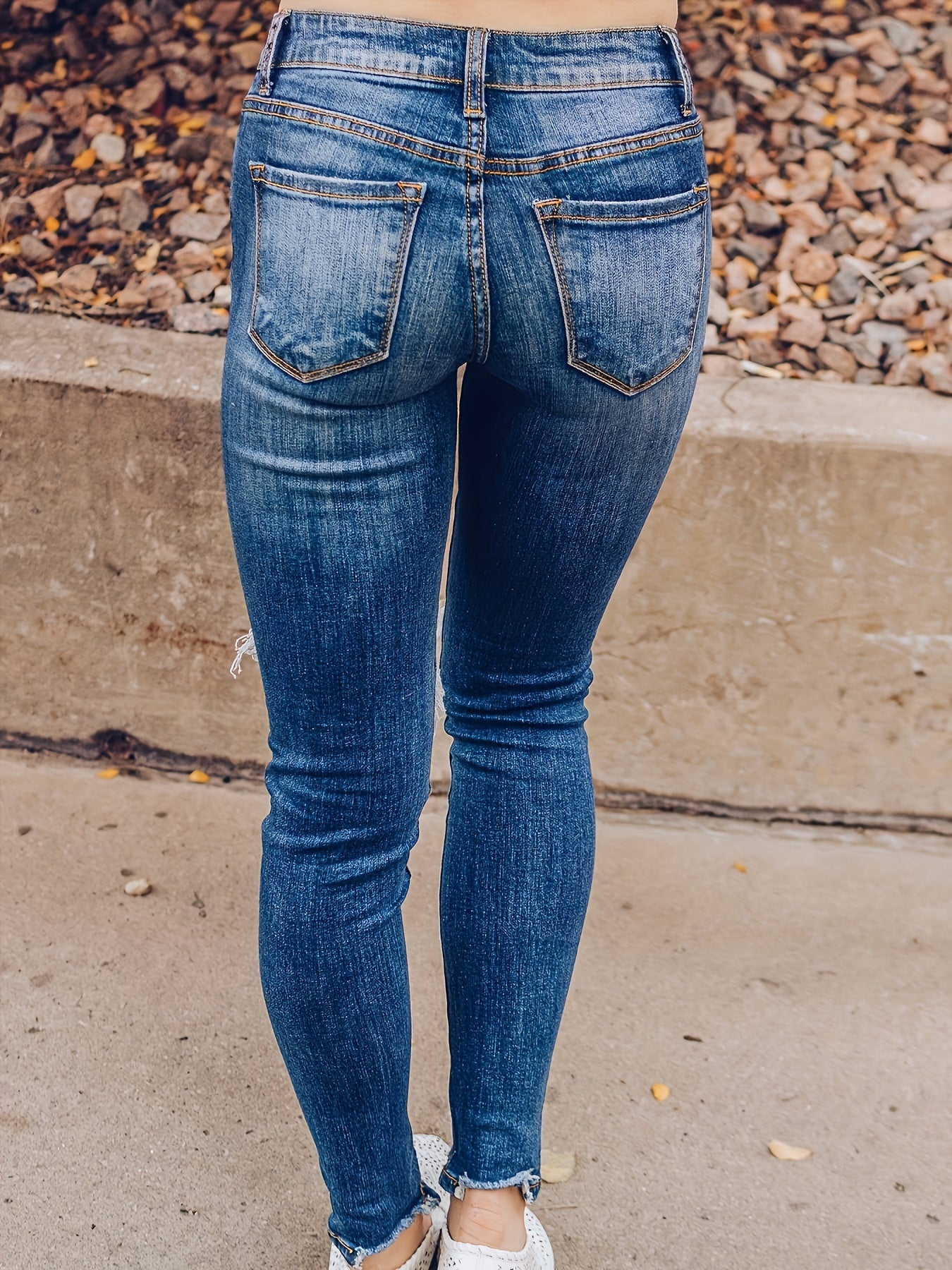 Vintage Distressed Skinny Jeans - Fashionable Ripped Detailing, High-Rise Fit, Trendy Denim Pants with Multiple Holes Design - Perfect for the Modern Womans Wardrobe