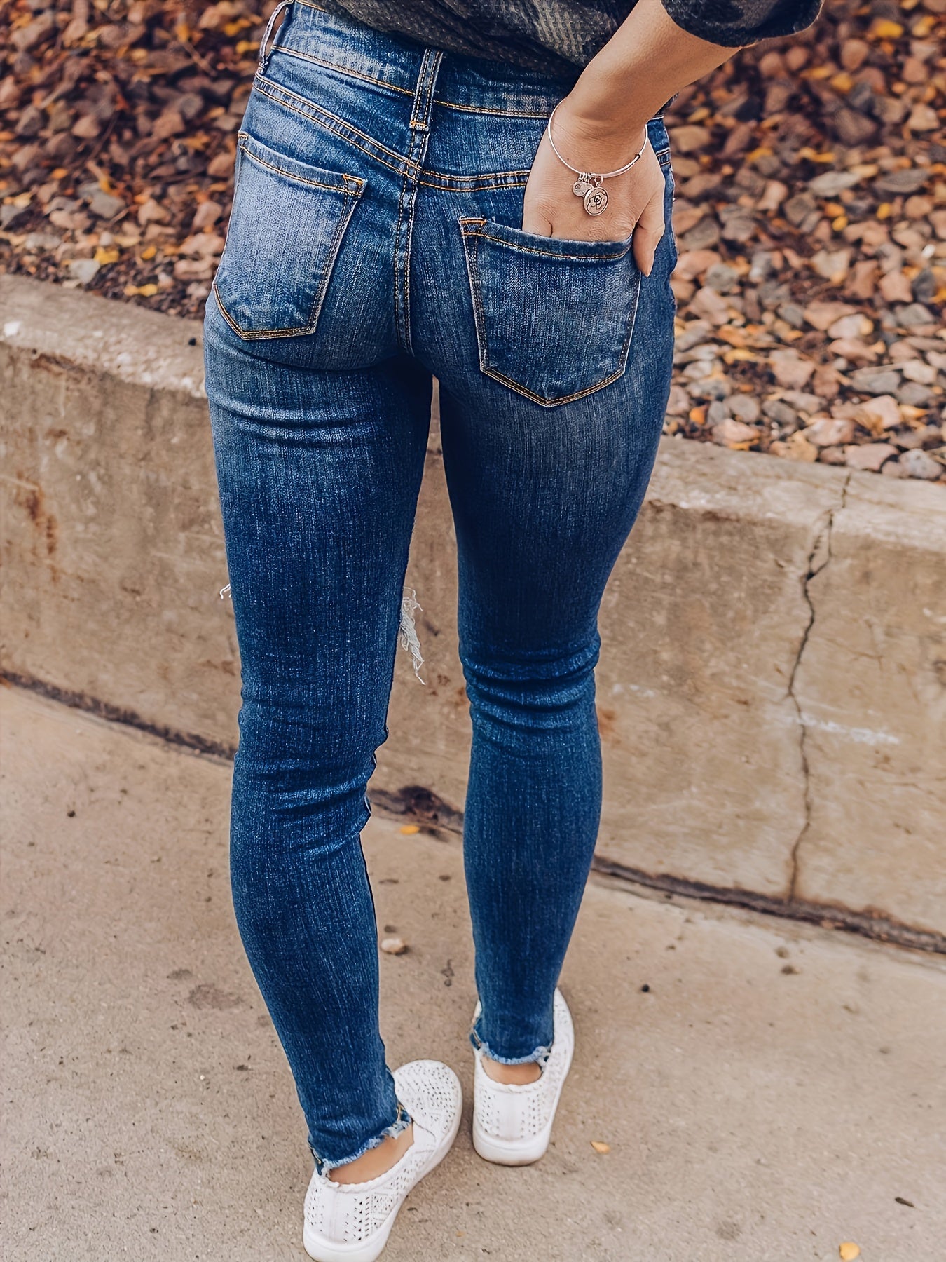 Vintage Distressed Skinny Jeans - Fashionable Ripped Detailing, High-Rise Fit, Trendy Denim Pants with Multiple Holes Design - Perfect for the Modern Womans Wardrobe
