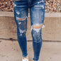 Vintage Distressed Skinny Jeans - Fashionable Ripped Detailing, High-Rise Fit, Trendy Denim Pants with Multiple Holes Design - Perfect for the Modern Womans Wardrobe