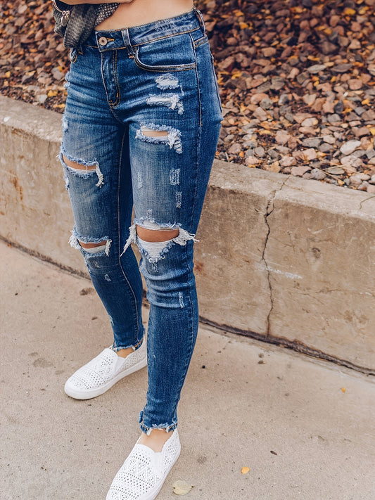 Vintage Distressed Skinny Jeans - Fashionable Ripped Detailing, High-Rise Fit, Trendy Denim Pants with Multiple Holes Design - Perfect for the Modern Womans Wardrobe